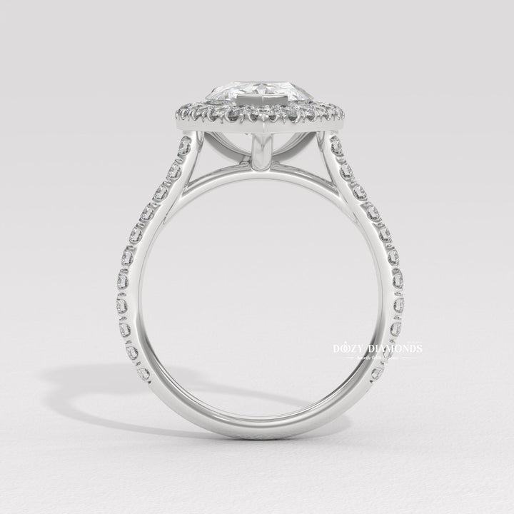 Profile view of pear cut halo engagement ring band