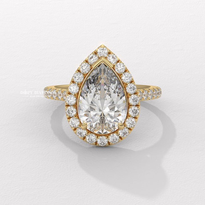 Pear cut halo engagement ring available to buy now