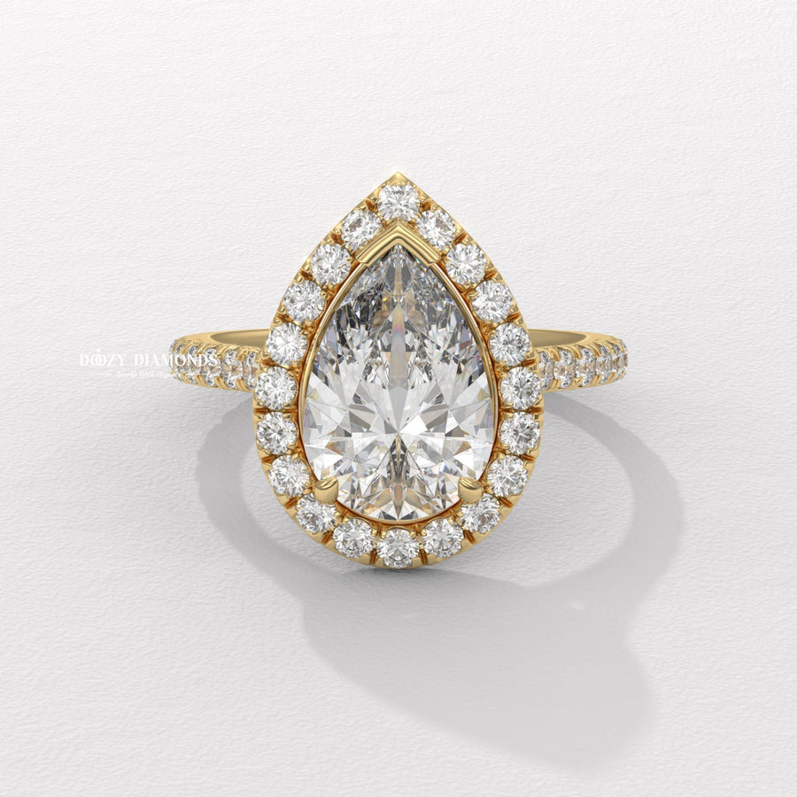 Pear cut halo engagement ring available to buy now