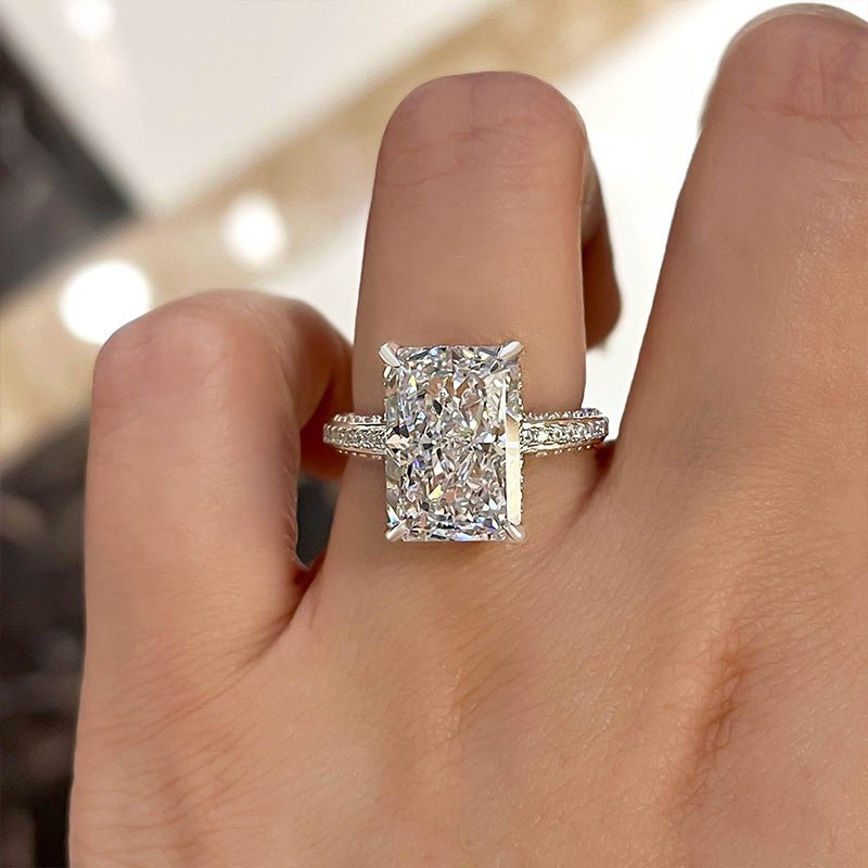 Radiant hidden halo engagement ring offered in gold and platinum