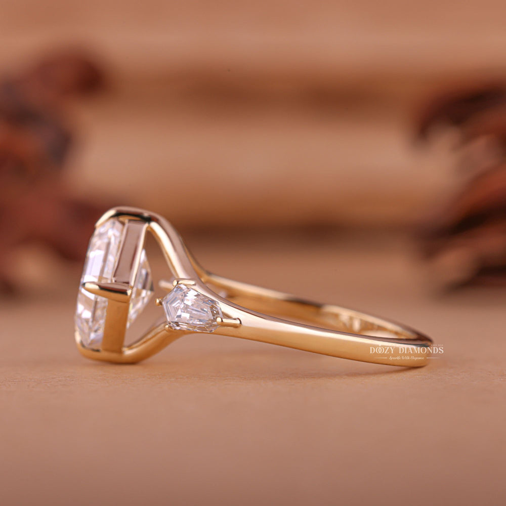 Angled view of asscher cut diamond in three stone setting