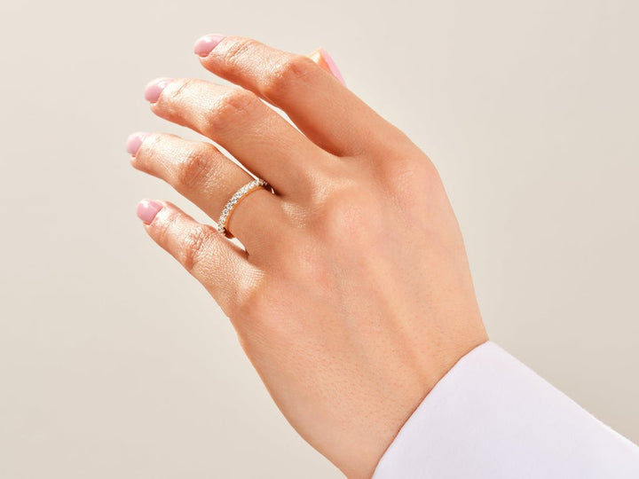 Round diamond band stacked with engagement ring