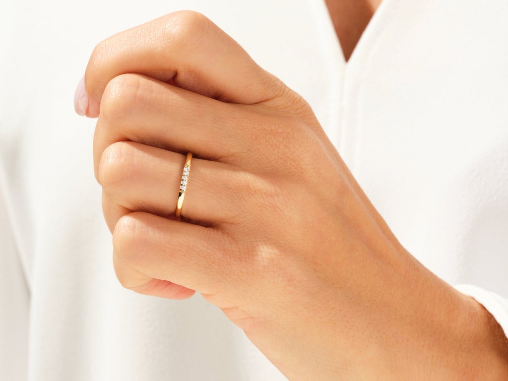 Round diamond wedding band in rose gold