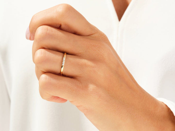 Round diamond wedding band in rose gold