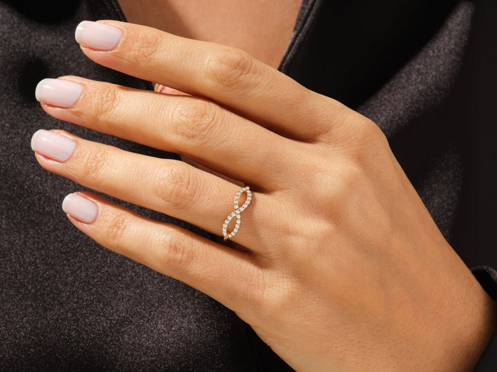 Round diamond band stacked with engagement ring