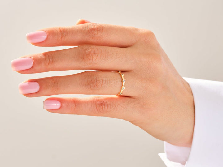 Round diamond wedding band in rose gold