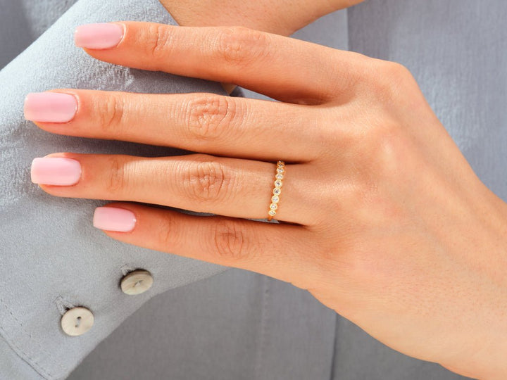 Round diamond wedding band in rose gold