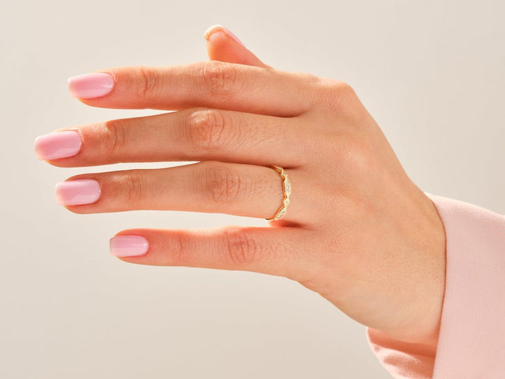 Round diamond wedding band in rose gold