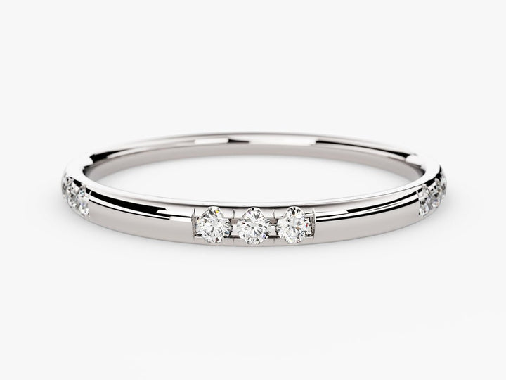 Round diamond band stacked with engagement ring