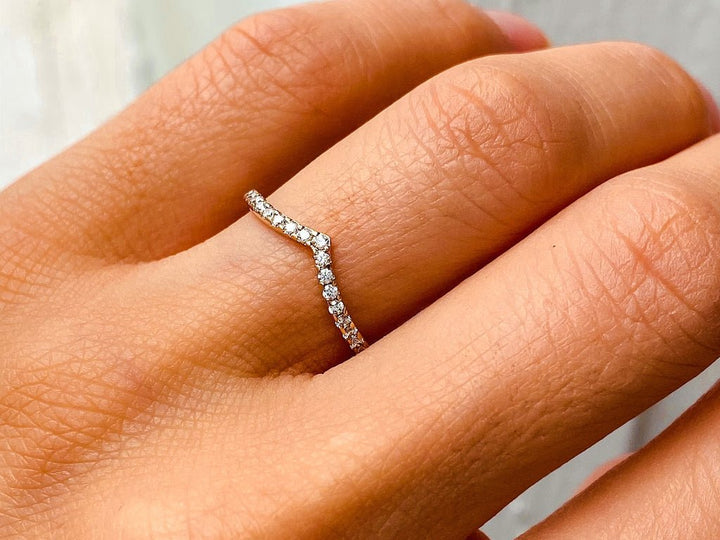 Round diamond wedding band in rose gold