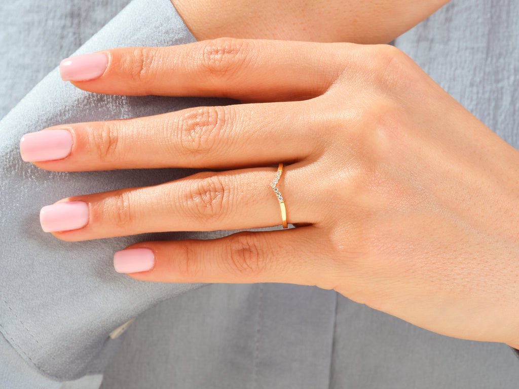 Round diamond wedding band in rose gold