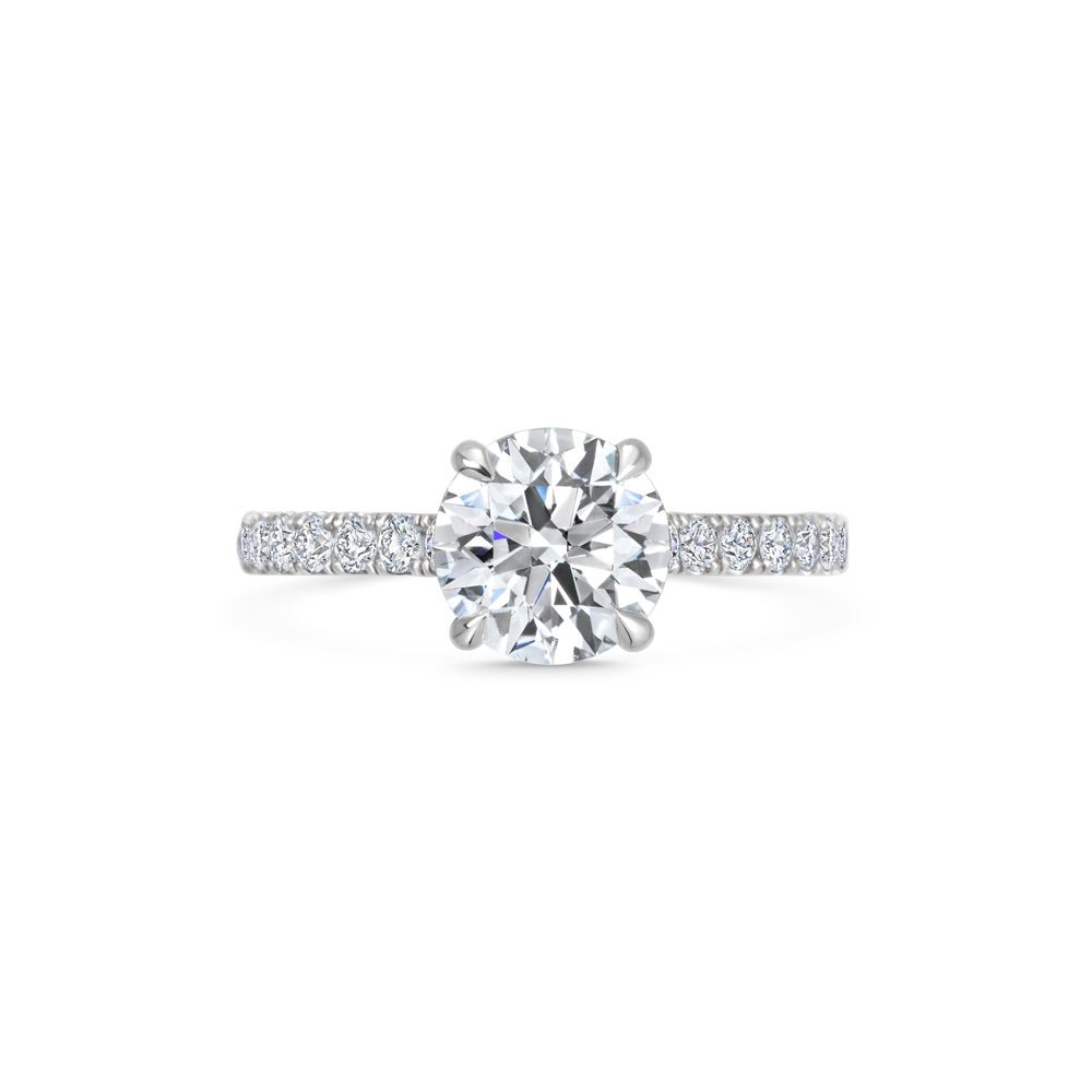 Round pave engagement ring viewed from the side