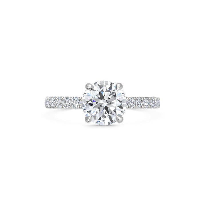 Round pave engagement ring viewed from the side