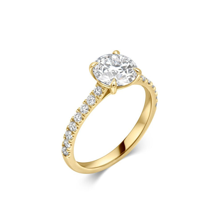 Round cut pave engagement ring shown in real-life wear
