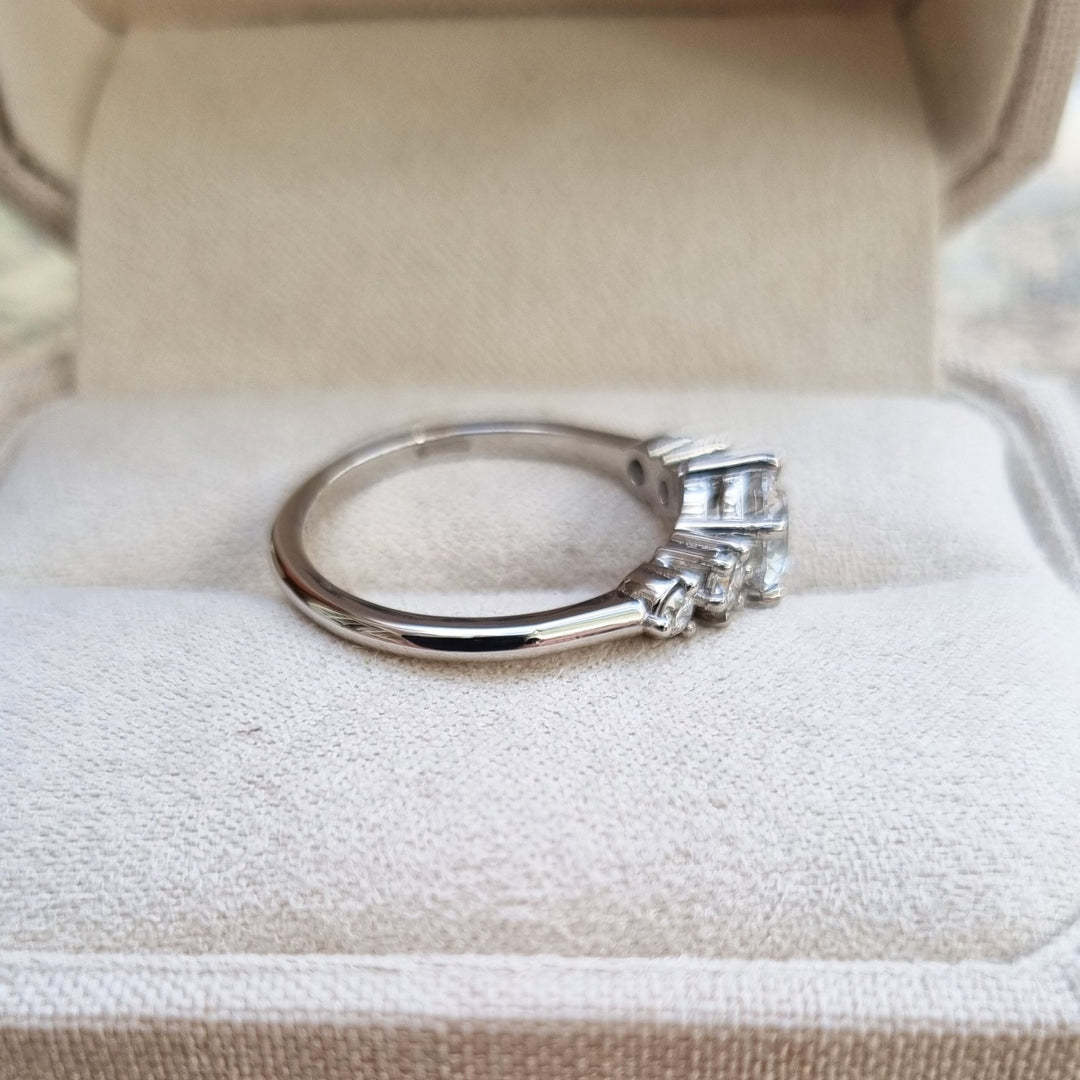 Round cut engagement ring shown with authenticity certificate