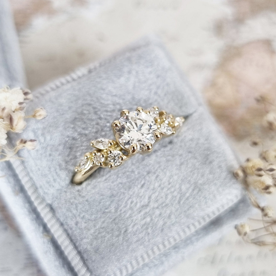 Round cut engagement ring shown with authenticity certificate