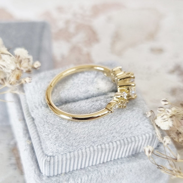 Round cluster engagement ring with IGI certificate and packaging