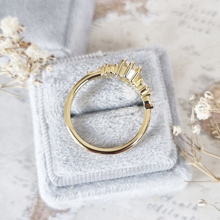 Unboxing view of round cut cluster diamond engagement ring