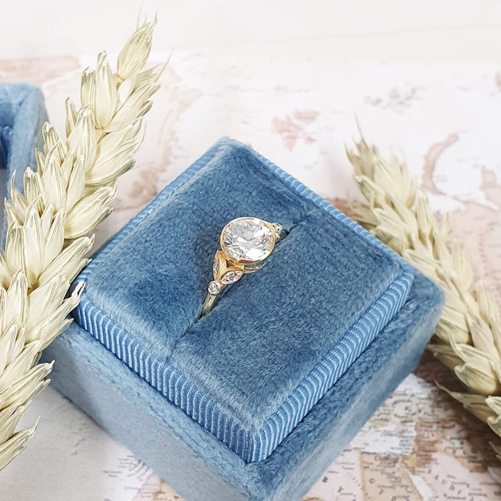 Fine craftsmanship detail on round bezel engagement ring
