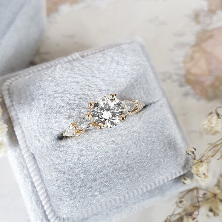 Round cut five stone engagement ring with IGI certified center diamond