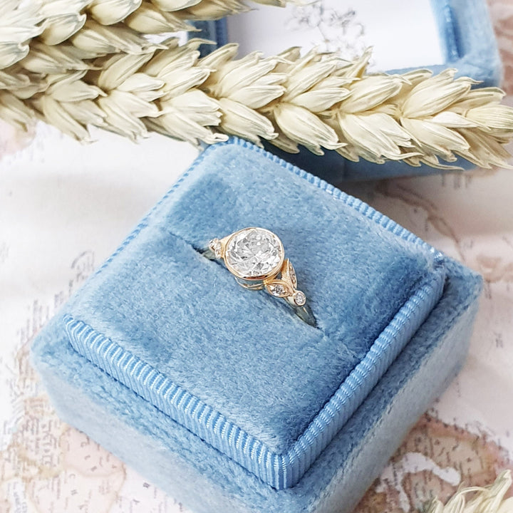 Round bezel engagement ring finished in polished solid gold