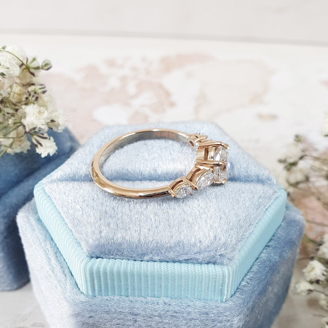 Oval five stone engagement ring close-up highlighting diamond sparkle