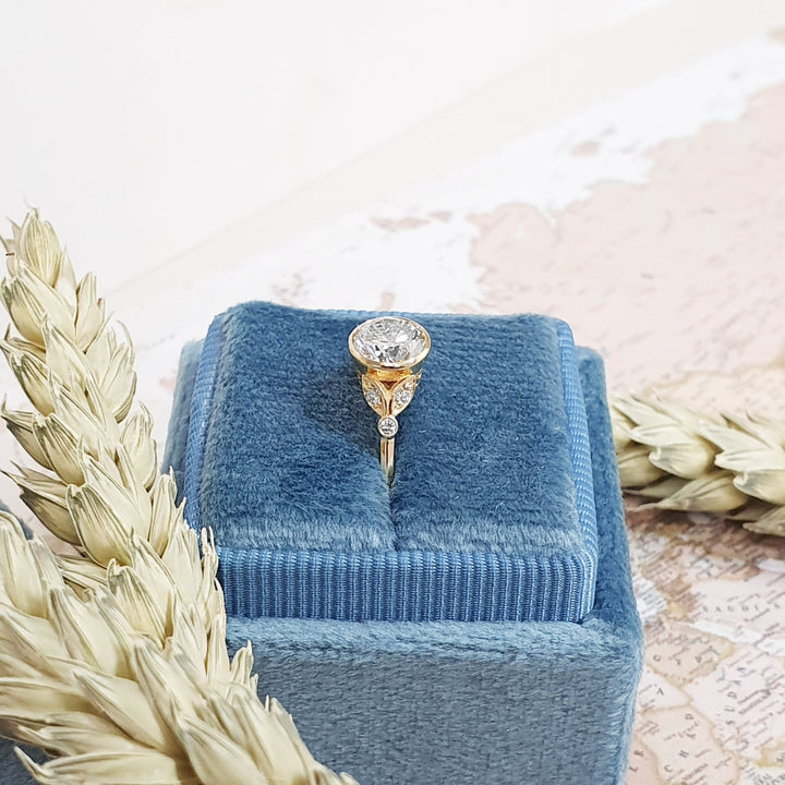 Top-down view of round cut bezel engagement ring