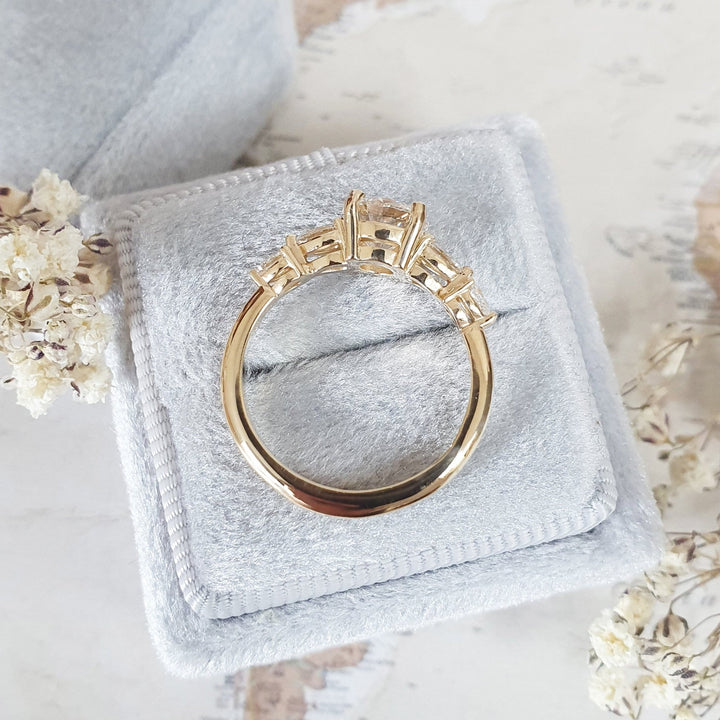 Round five stone lab grown diamond ring fitted on finger
