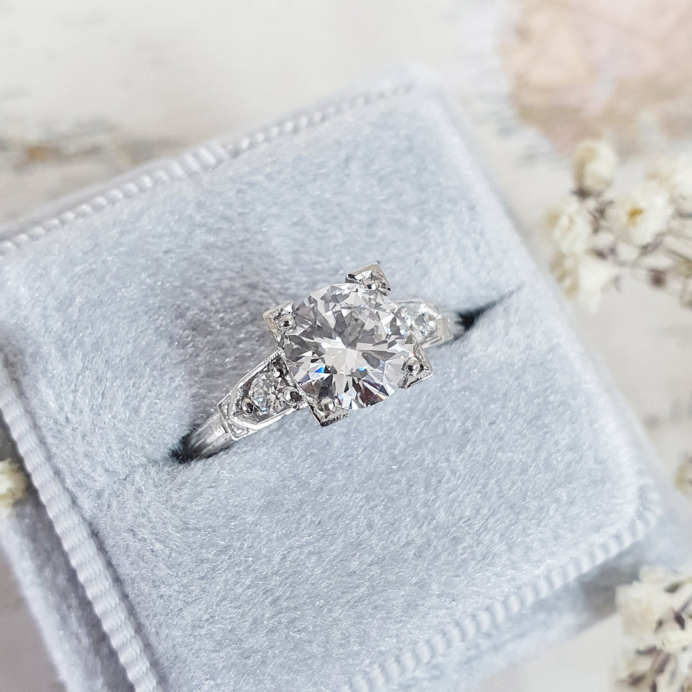 Classic round three stone engagement ring crafted for everyday wear
