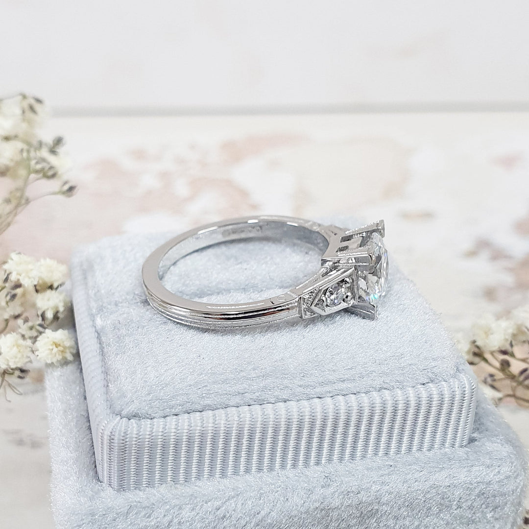 Fine craftsmanship detail on round three stone engagement ring