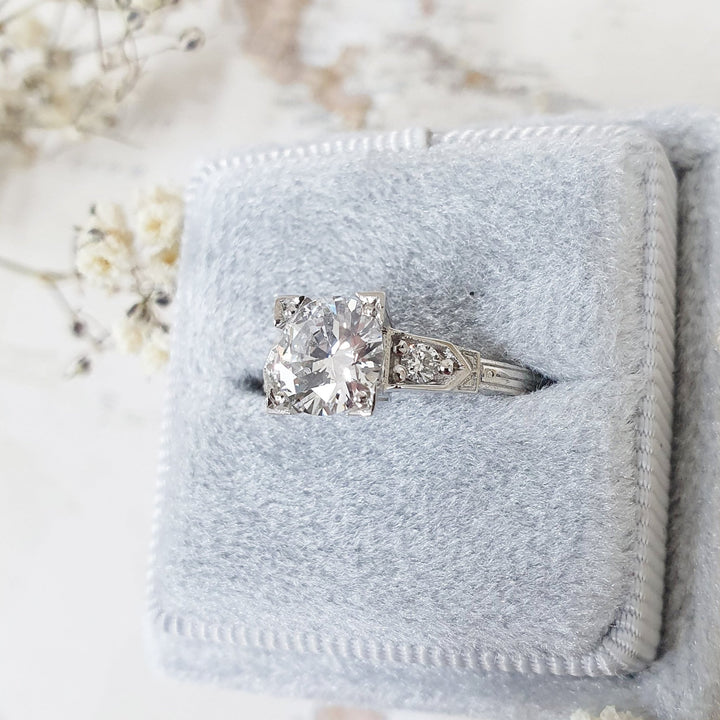 Handcrafted round cut three stone lab grown diamond engagement ring