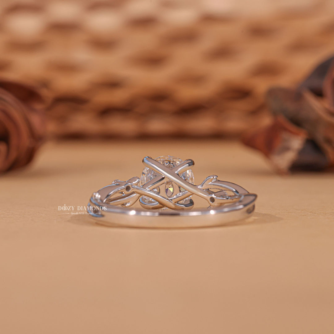Round solitaire diamond ring displayed on jewelry stand