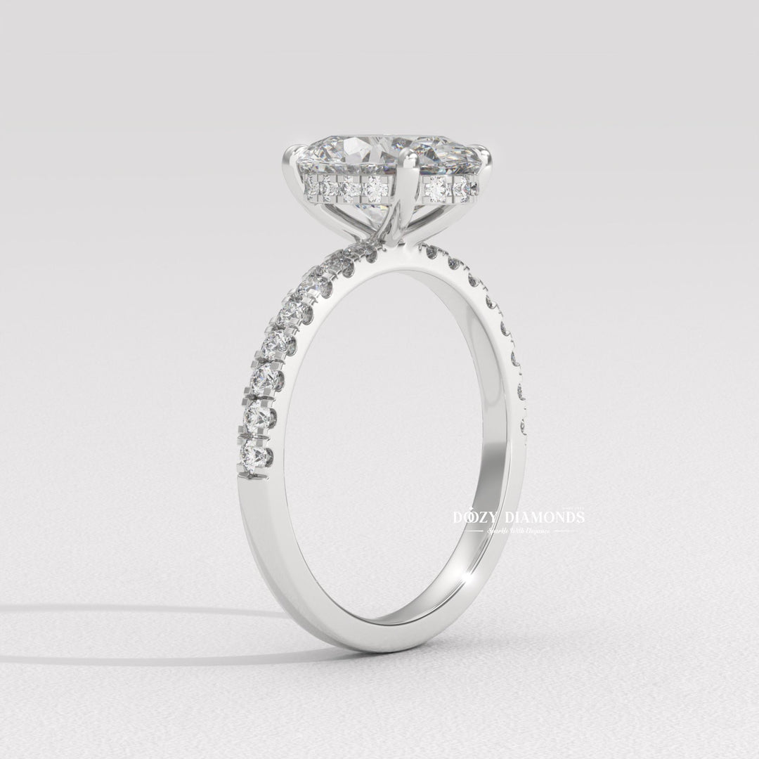 Macro shot of oval cut diamond facets in hidden halo ring setting