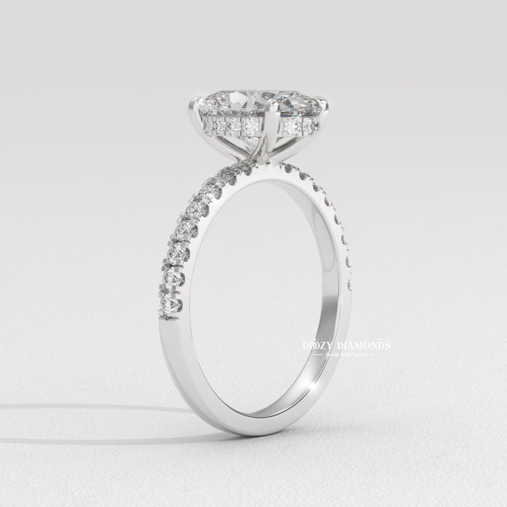 Macro shot of oval cut diamond facets in hidden halo ring setting