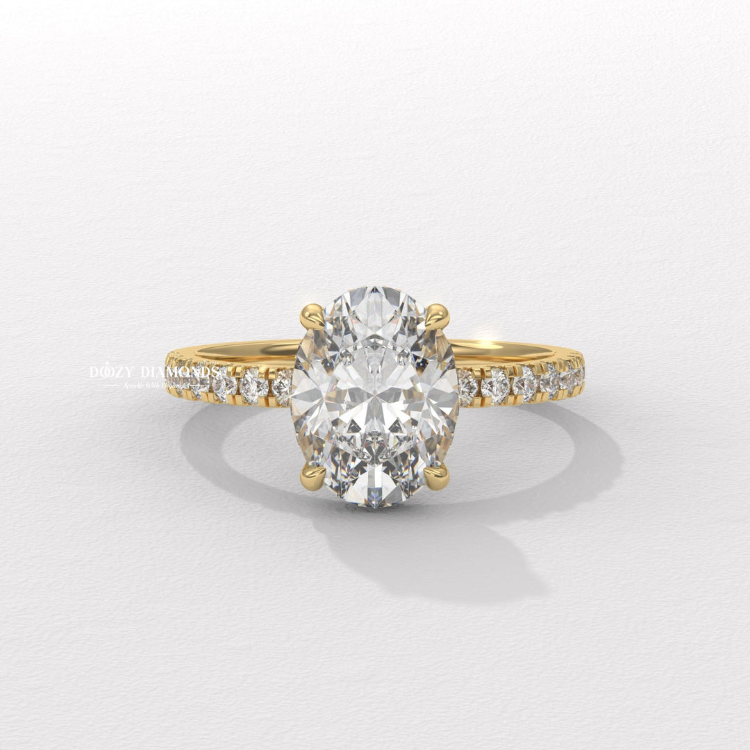 Oval cut hidden halo engagement ring available to buy now