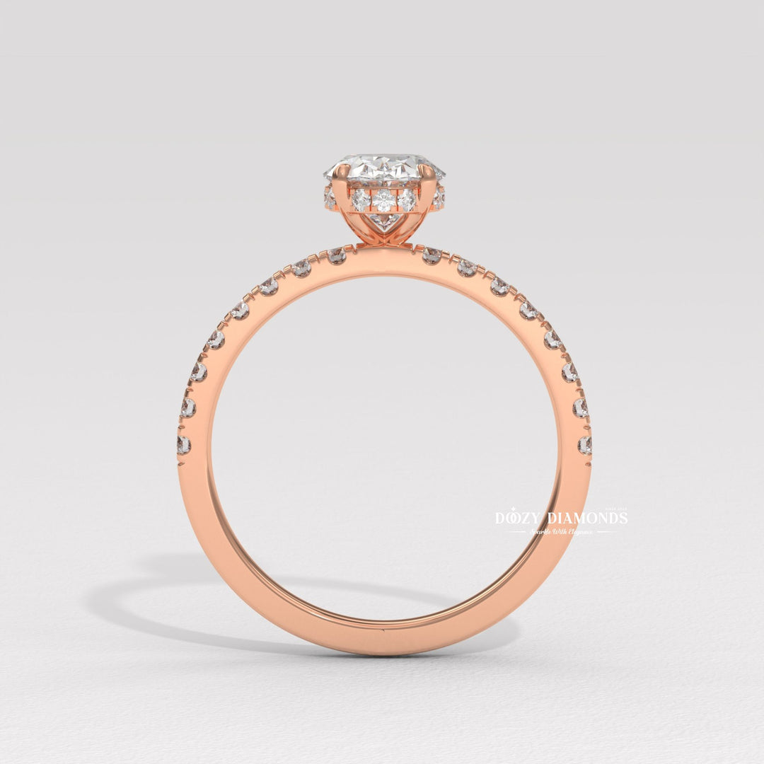 Oval hidden halo engagement ring close-up showing high clarity diamond clarity