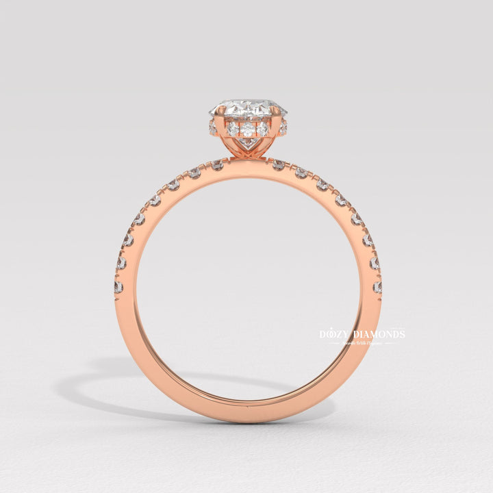 Oval hidden halo engagement ring close-up showing high clarity diamond clarity