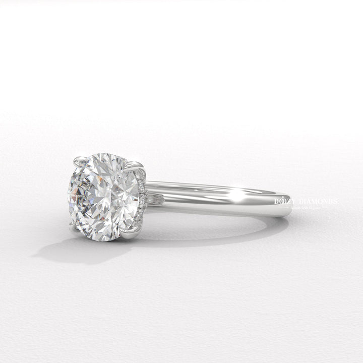 Round hidden halo engagement ring close-up highlighting diamond sparkle