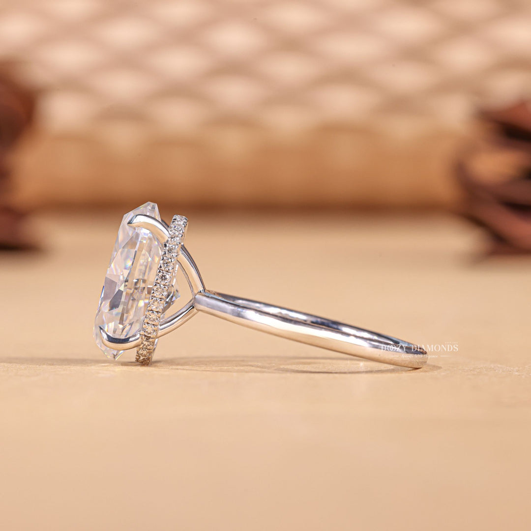 Fine craftsmanship detail on oval hidden halo engagement ring