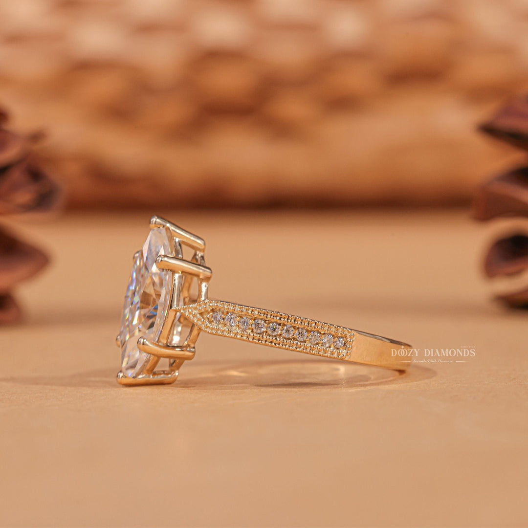 Certified marquise cut diamond featured in milgrain engagement ring