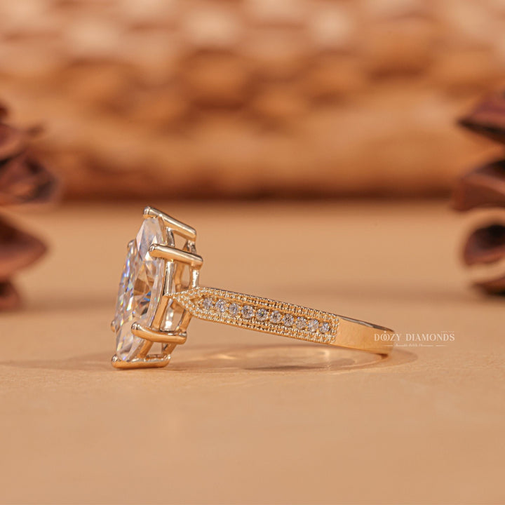 Certified marquise cut diamond featured in milgrain engagement ring