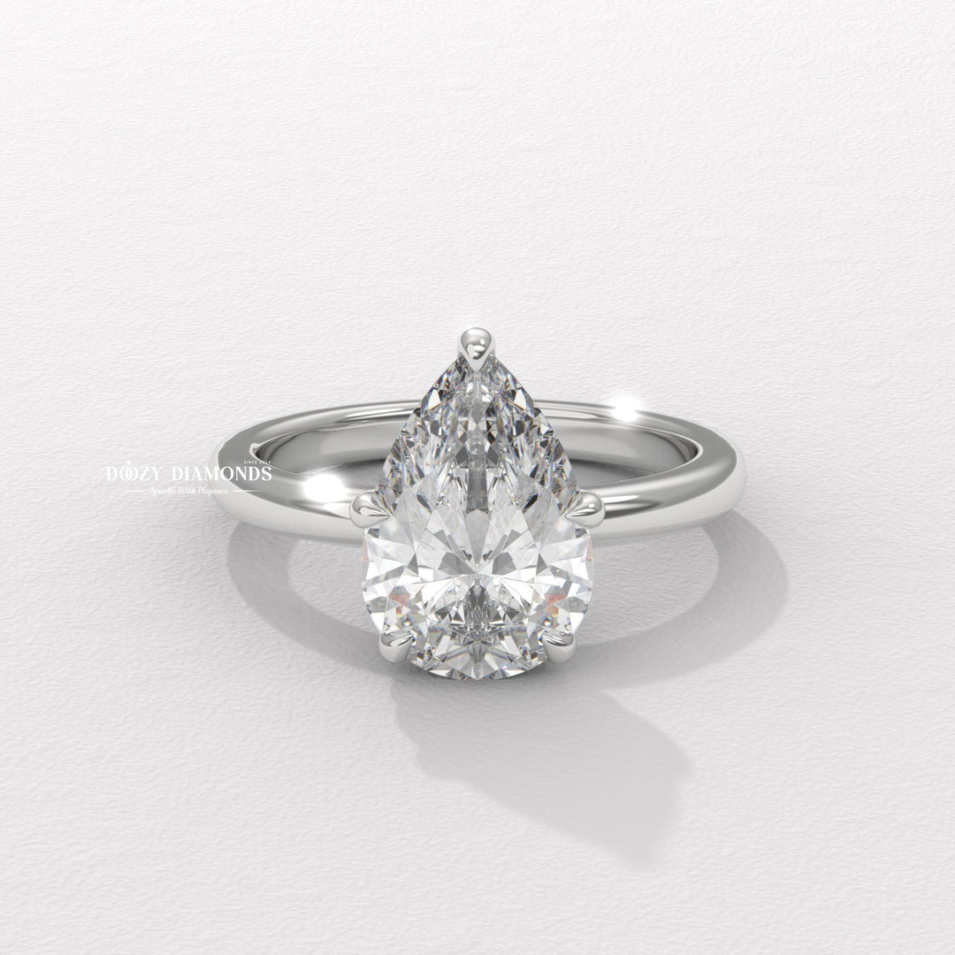 Classic pear hidden halo engagement ring crafted for everyday wear