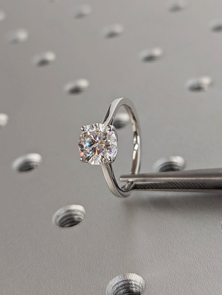 Macro shot of round cut diamond facets in solitaire ring setting