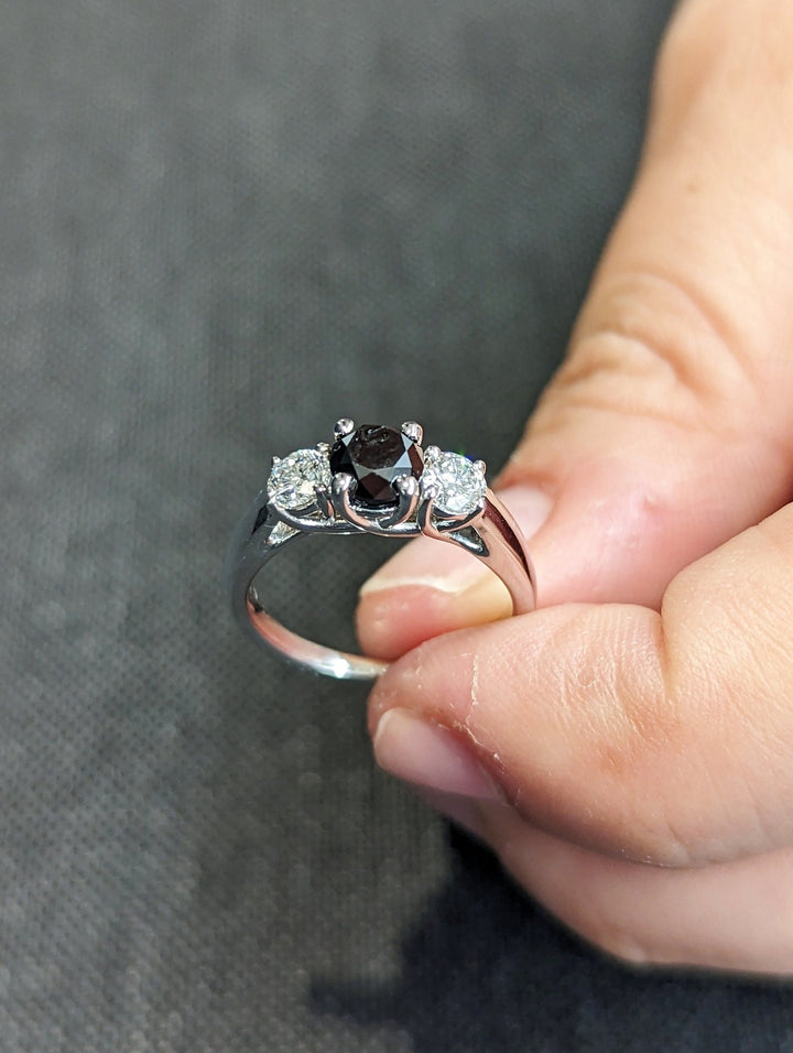 Profile view of round cut solitaire engagement ring band