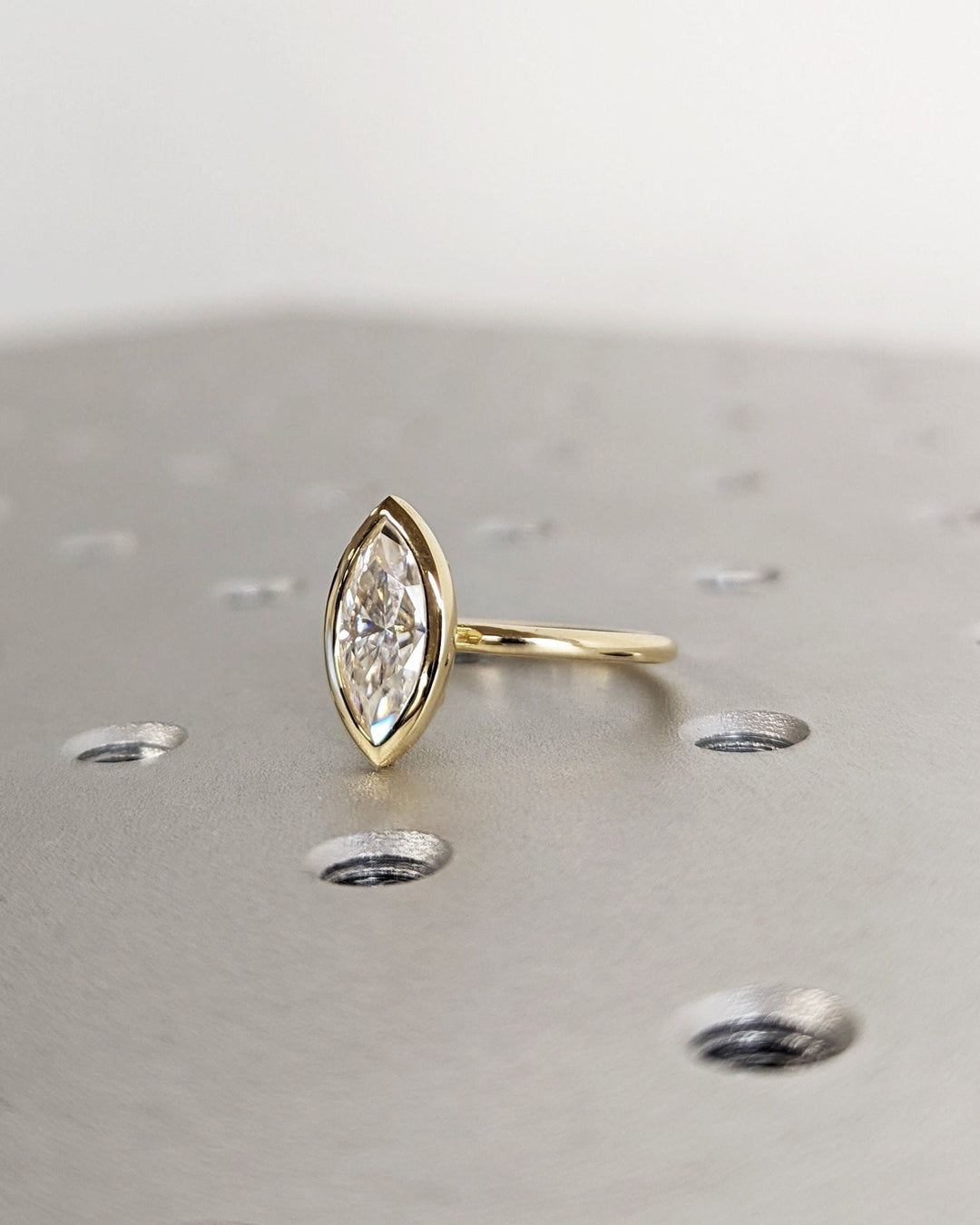 Marquise bezel engagement ring close-up highlighting diamond sparkle
