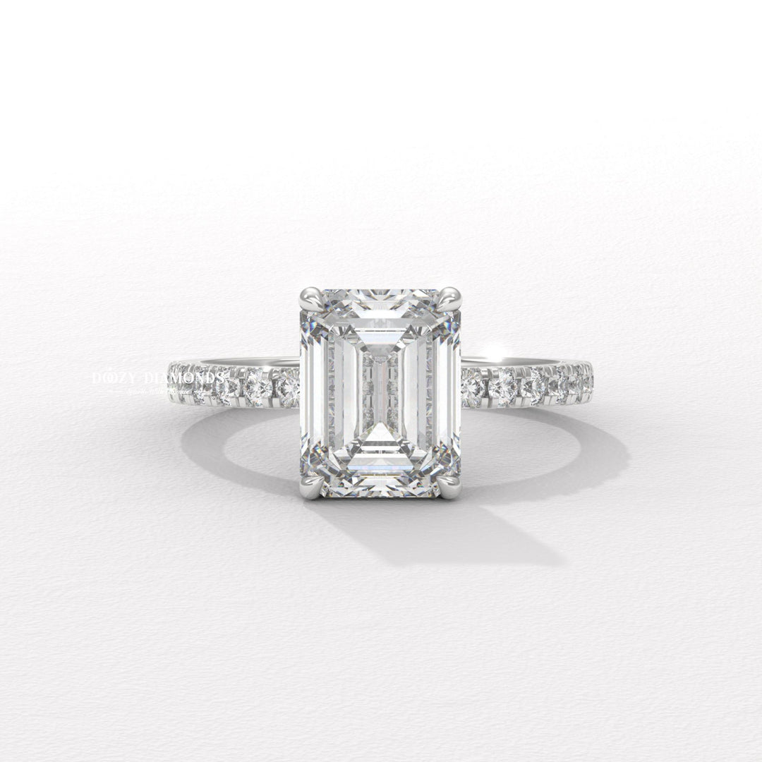 Lifestyle shot of emerald pave diamond ring on hand