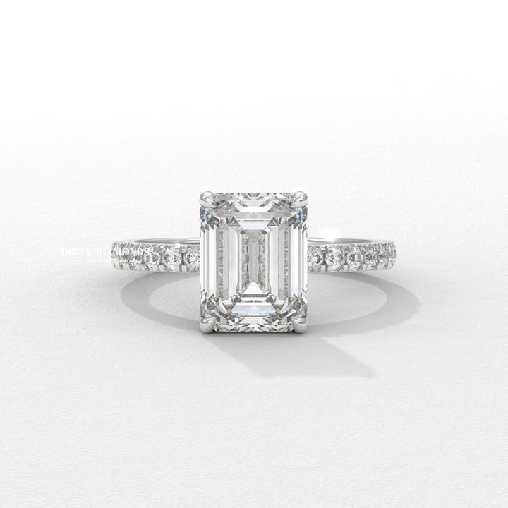 Lifestyle shot of emerald pave diamond ring on hand