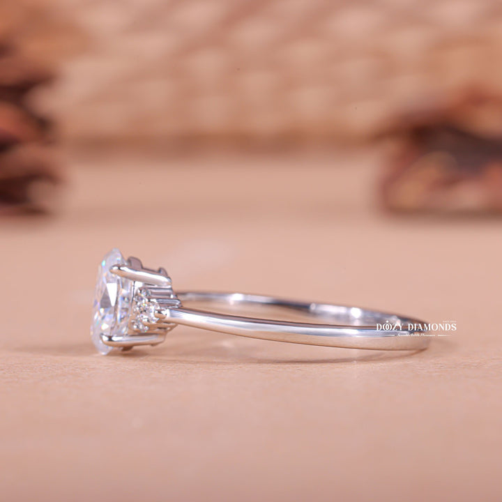 Oval cut cluster engagement ring with IGI certified center diamond