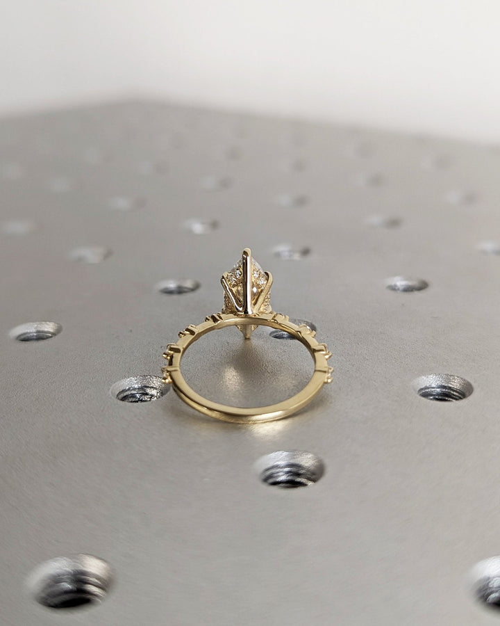 Premium marquise cut hidden halo engagement ring crafted in solid gold