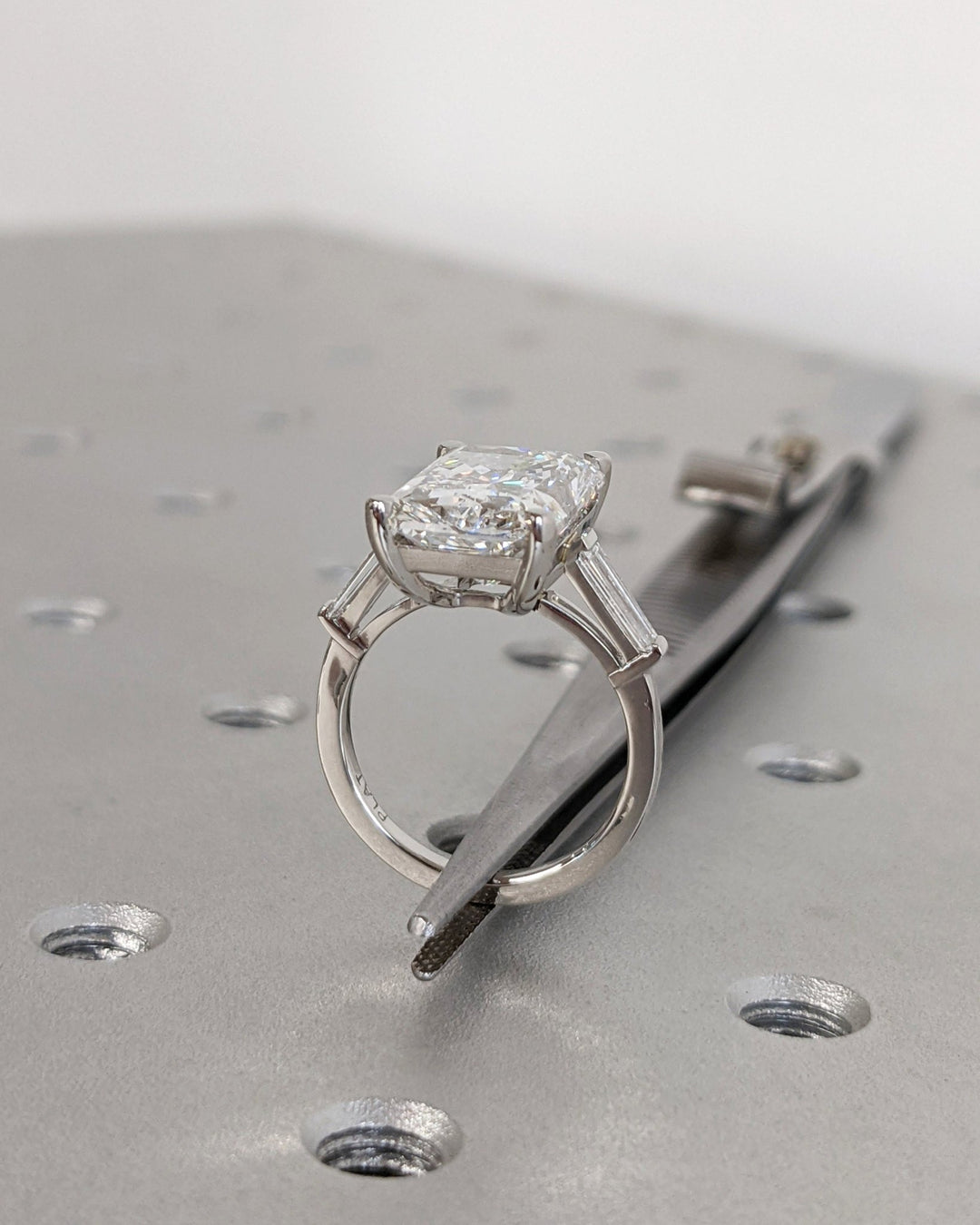 Radiant cut engagement ring side view showing band detail